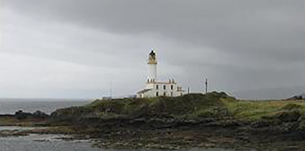 Light house in front of the sea